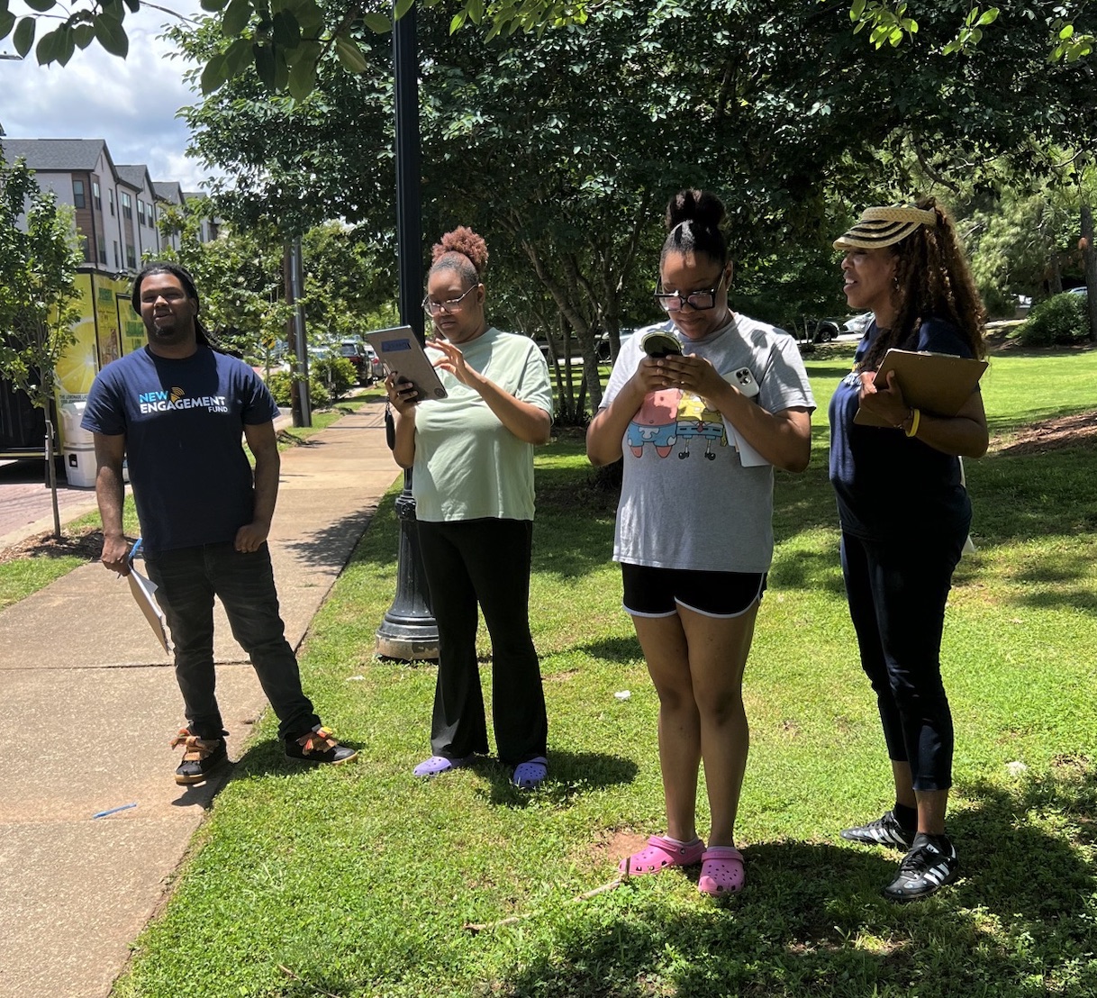 Four New Engagement Fund team members standing together outdoors